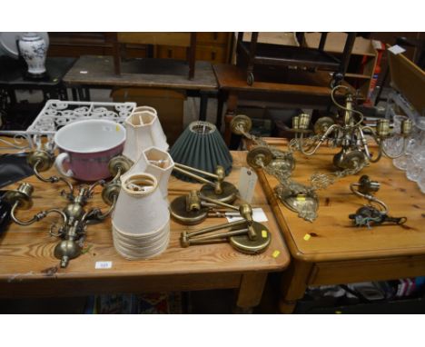 A quantity of various brass light fittings, wall lights, lamp shades; and an Edwardian chamber pot 