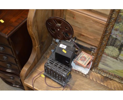 A Bingoscope home cinema cine projector; together with a quantity of Pathescope reels