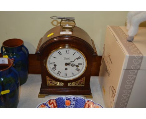 A Comitti of London mahogany cased three hole bracket clock 