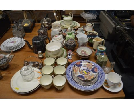 A silver plated three piece teaset; together with a quantity of various tea cups and saucers; a glass comport; and various ot