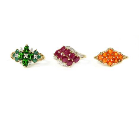 Three 9ct gold rings, to include a ruby and diamond ring, Birmingham 2005, a fire opal cluster ring, Birmingham 2000, and an 