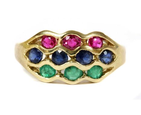 A 9ct gold ruby, sapphire and emerald ring, three rows of circular mixed cut rubies, sapphires and emeralds, channel set to u