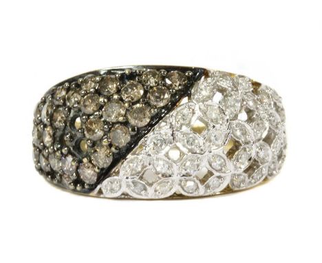 A 9ct gold fancy brown and white diamond bombé cluster ring, with a pavé and lattice style head, three diamonds deficient, to