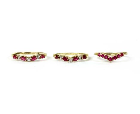 A pair of 9ct gold ruby and diamond shaped rings, Birmingham 2002, together with a 9ct gold ruby wishbone ring, Birmingham 20