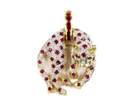A gold ruby and diamond panther brooch/pendant, the panther grain set throughout with circular mixed cut rubies, possibly syn