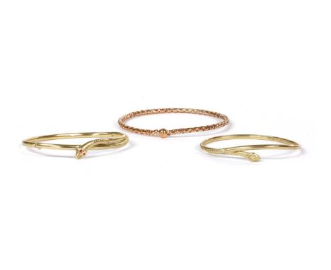 A 9ct gold hollow snake or serpent torque bangle, Sheffield, internal dimensions 57 x 52mm, together with a 9ct gold oval hin
