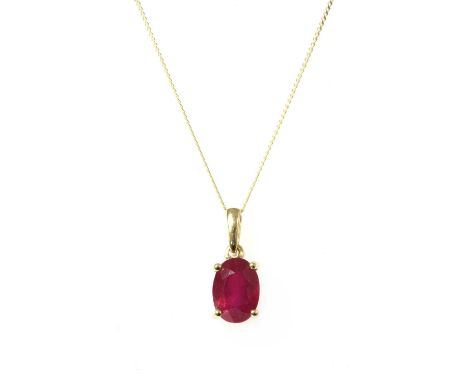 A gold single stone ruby pendant, an oval mixed cut ruby, possibly fracture filled, 6.98 x 5.04 x 4.19mm, claw set to articul