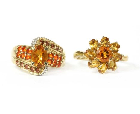 A 9ct gold citrine cluster ring, with a circular mixed cut orange citrine, to border of pear mixed cut yellow citrines, Birmi