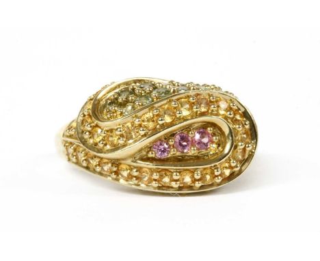 A 9ct gold varicoloured sapphire ring, the ribbon design head grain set with circular mixed cut pink, yellow and green sapphi