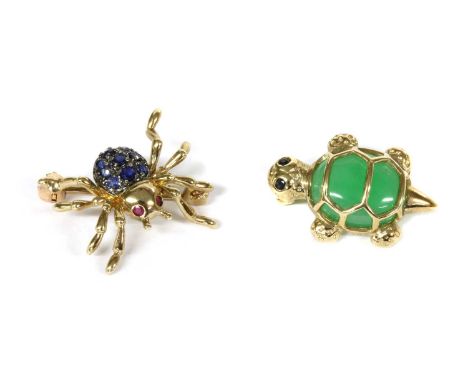 A 9ct gold ruby and sapphire set spider brooch/pendant, with round mixed cut ruby eyes, and round mixed cut sapphires grain s