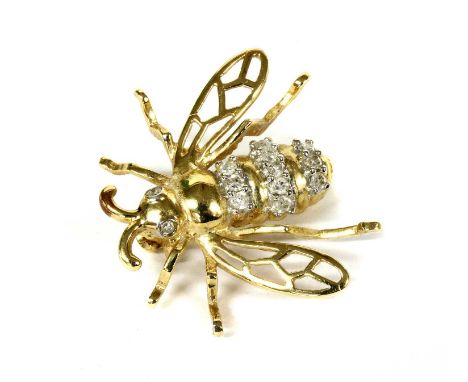 A 14ct gold diamond set bee brooch, with rows of eight cut diamonds claw set to the abdomen, and eight cut diamonds rub set f