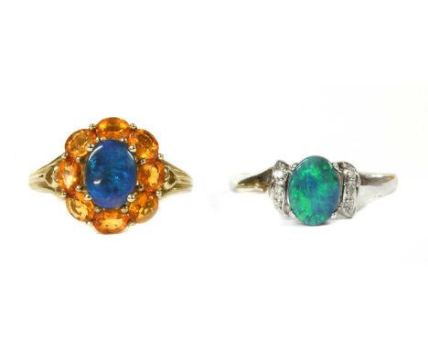 A 9ct white gold opal and diamond ring, Birmingham 2005, together with a 9ct gold opal and orange gemstone cluster ring, prob