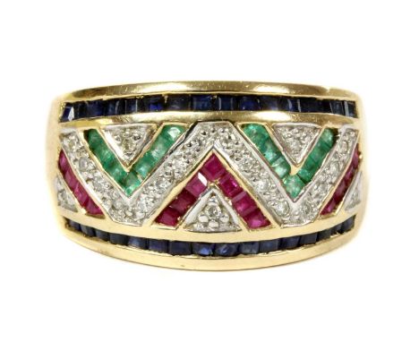 A 9ct gold ruby, sapphire, emerald and diamond ring, of geometric chevron design, channel set with square step cut rubies, sa