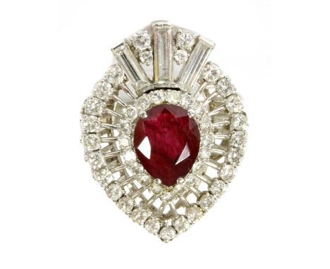 A white gold ruby and diamond ring, with a pear mixed cut ruby, possibly fracture filled, 10.69 x 8.52 x 3.00mm, claw set to 