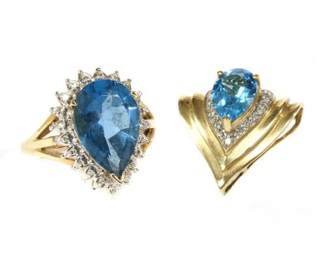 A 9ct gold blue topaz and diamond cluster ring, a pear mixed cut blue topaz, approximately 15.5 x 10.0mm, with surround of ei