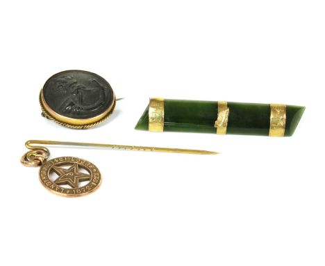 A 9ct gold Masonic lodge pendant, by Robert Pringle &amp; Sons, Birmingham 1922, suspended on a gilt metal stick pin, a New Z