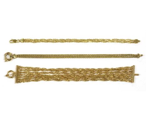 A 9ct gold seven row twisted curb link bracelet, with bolt ring clasp, Birmingham, 185mm long, together with a 9ct gold plait