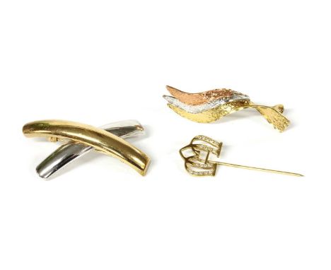 A 9ct rose, white and yellow gold spray brooch, with textured finish to pin and roller catch, Sheffield, 40mm long, together 