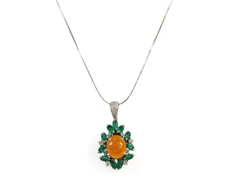 A white gold fire opal, emerald and diamond pendant, an oval cabochon fire opal, approximately 13.0 x 10.5mm, claw set to sur