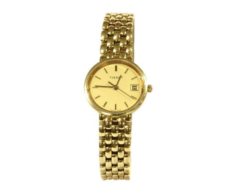A ladies' gold Tissot quartz bracelet watch, 25mm diameter with a champagne dial, baton hour markers and date aperture at '3'