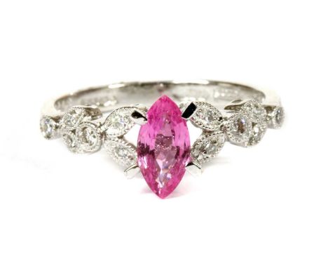 An 18ct white gold pink sapphire and diamond ring, a marquise mixed cut pink sapphire, with a stated weight of 0.30ct, claw s