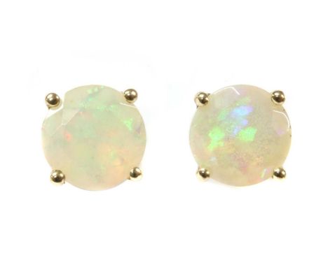 A pair of gold single stone opal stud earrings, a circular mixed cut opal, 5.9 to 6.0mm, claw set to post and butterfly fitti