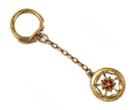 A 9ct gold keyring, a disc with a red, white and green enamelled rose, to trace link chain and ring fitting, Birmingham 1956,