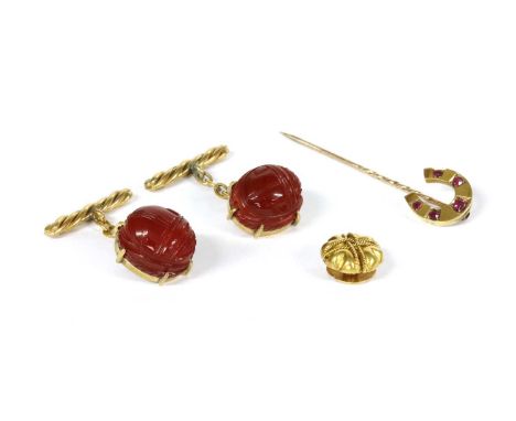 A small quantity of gentlemen's jewellery, to include a Victorian gold ruby set horseshoe stick pin, tested as approximately 