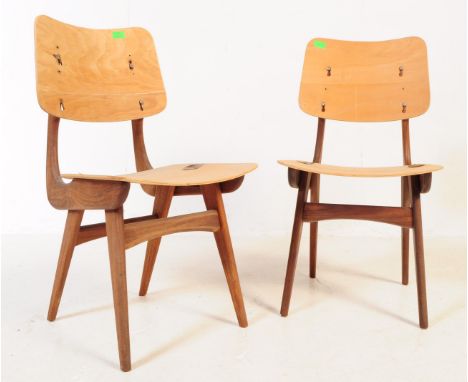 Pair of vintage 20th century Danish manner teak dining chairs. With panel back rest and seat, curved frame supported on taper