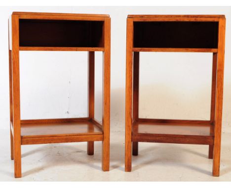 A pair of mid 20th century Air Ministry manner oak bedside tables. The bedsides raised on four squared supports connected by 