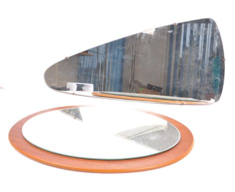 Two vintage mid 20th century teak wall atomic wall mirrors. One having an irregular&nbsp; shaped front with mirror set behind