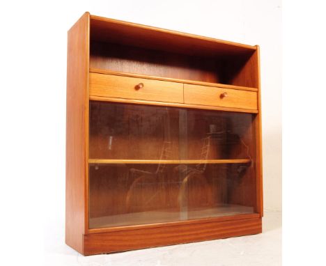 Nathan - A retro mid 20th century circa. 1970's Nathan teak bookcase cabinet having a shelf over two rectangular drawers over