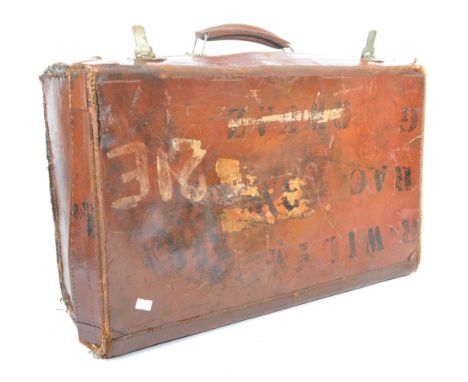 A 20th century leather bound military suitcase trunk. The case of rectangular form, with brass latch closure to front either 