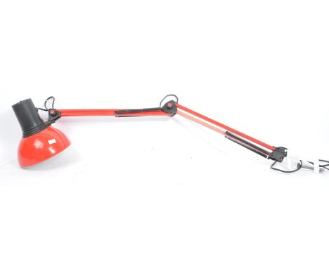 A late 20th century anglepoise desk lamp. The lamp finished in a red colourway, with articulated arm, terminating in a clamp 