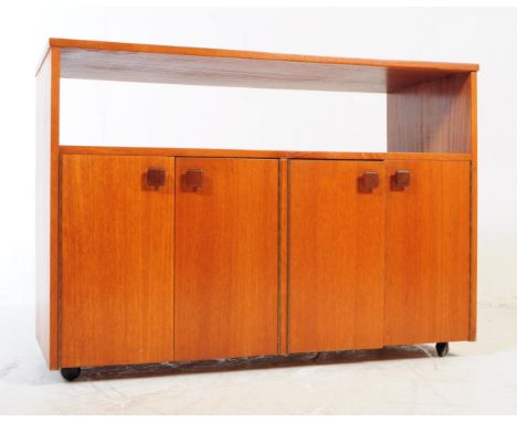 British Modern Design - A vintage circa 1970's British teak sideboard / highboard console cabinet. Having an open shelf with 