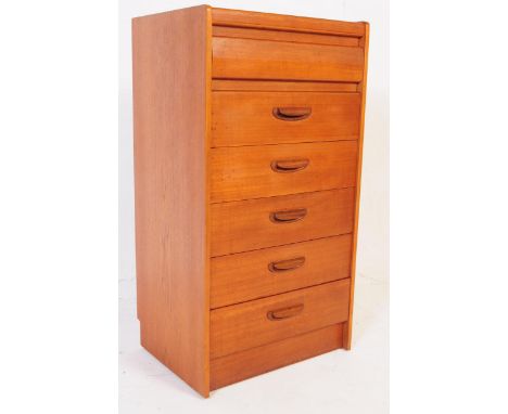 British Modern Design - A retro mid century teak tall boy chest of drawers. Of rectangular form with a bank of six drawers wi