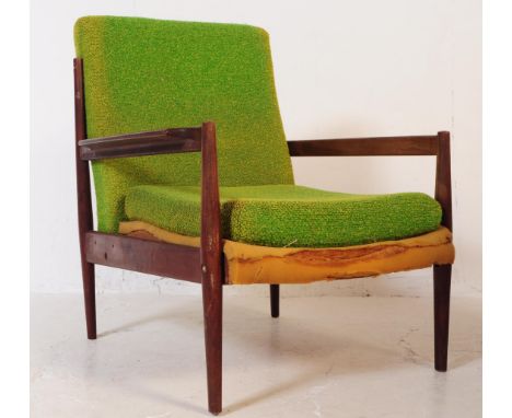 A retro mid 20th century teak low armchair in the manner of Grete Jalk Model. With green fabric drop in cushioned seat and ba