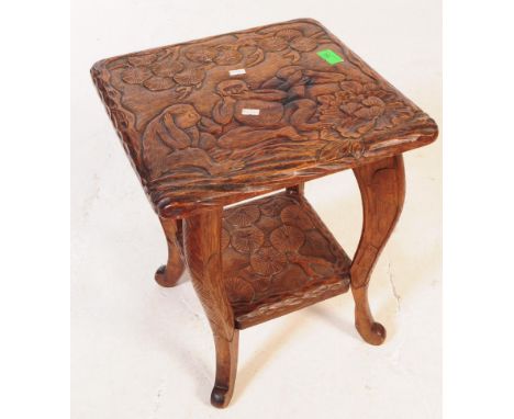 A vintage 20th century Japanese carved occasional table in the manner of Liberty of London.&nbsp; Of square form with carved 