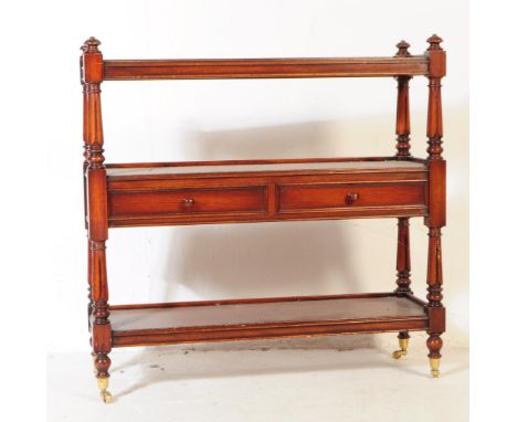 A Victorian revival mahogany three tier buffet - etagere stand.&nbsp;The trolley having a double drawer with round pull handl