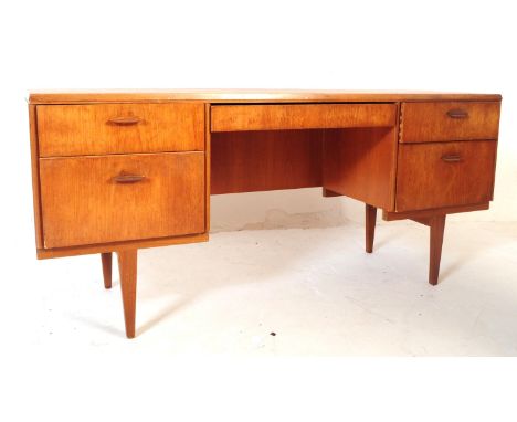 Beithcraft Furniture - A mid 20th century teak writing office / school desk table. Rectangular form with knee hole centre fla