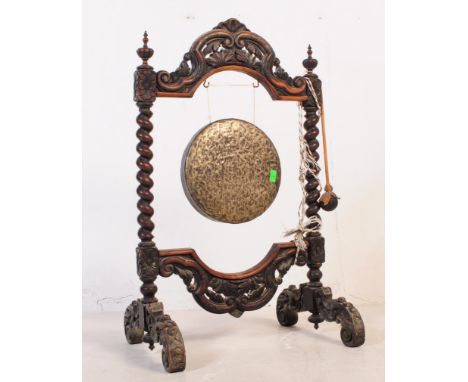 A Victorian 19th century Chinese hanging bronze&nbsp;gong and stand with wooden handled strike. Housed within a ornate carved