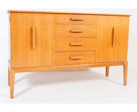 British Modern Design - A vintage 20th century oak sideboard credenza. Of rectangular form with flared top, bank of four draw