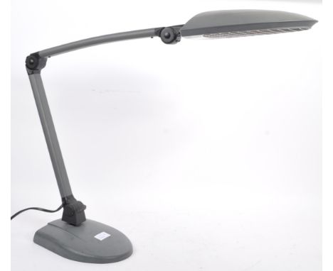 A vintage 20th Century 1990s articulated desk lamp light having grey plastic shade supported by an adjustable right angled ar