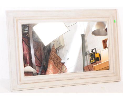 A vintage mid 20th century painted pine hanging wall mirror. Rectangular form with glass central mirror plate and solid wood 