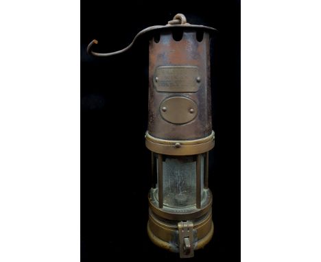 A J.H Naylor Ltd miners safety lamp, impressed serial number 59955, 35cm tall including handing wire
