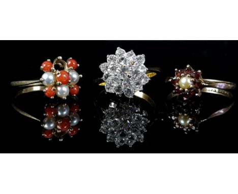 A garnet and pearl ring set in 9ct yellow gold, a CZ dome ring; and a coral and pearl ring set in 9ct yellow gold