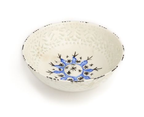 A SAFAVID GOMBROON POTTERY BOWL, PERSIA, CIRCA 1700 the white interior with convex central boss painted with black stars in a