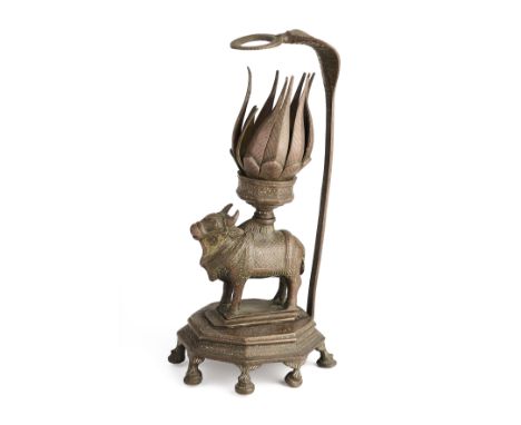 A BRONZE TEMPLE LAMP, TAMIL NADU, SOUTH INDIA, 19TH CENTURY in the form of Nandi Bull, standing on an octagonal base, support