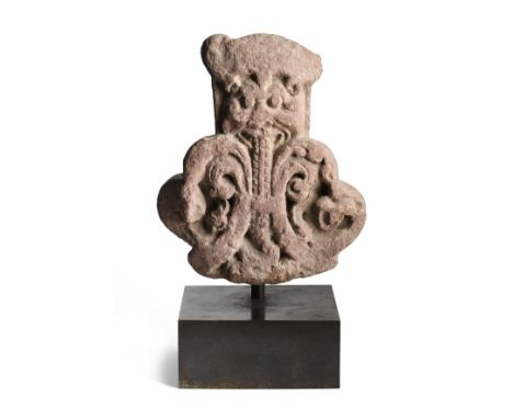 A KUSHAN MOTTLED PINK SANDSTONE ARCHITECTURAL FINIAL, MATHURA, NORTHERN INDIA, 2ND/3RD CENTURY carved in relief with a kirtim