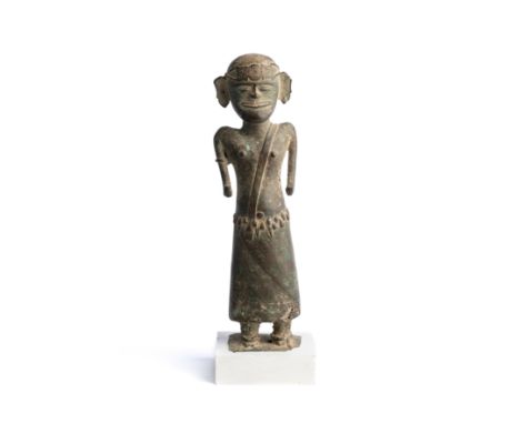 AN ORACLE FIGURE, KERALA, INDIA, 18TH/19TH CENTURY wearing a dhoti and elaborate belt, a strap over his left shoulder, a band